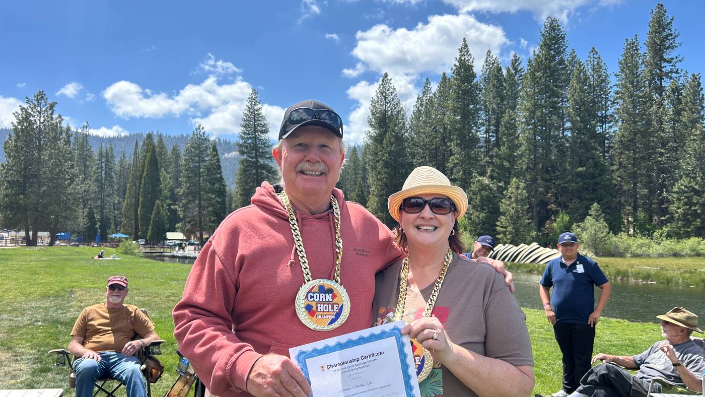 A married couple smiling together at New Hope's Ignite marriage ministry retreat at Hume Lake