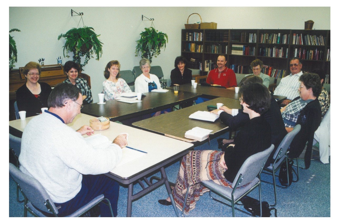 A New Hope adult Bible study around a long table in the old classroom, late 1990s