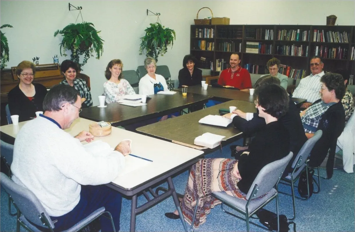 A New Hope adult Bible study around a long table in the old classroom, late 1990s
