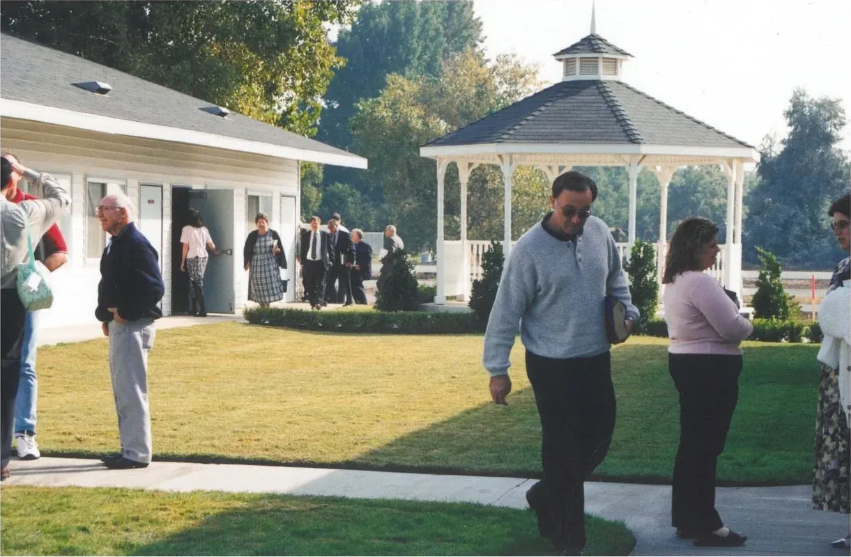 New Hope members walking toward the gazebo and pavilion after a service, late 1990s or early 2000s