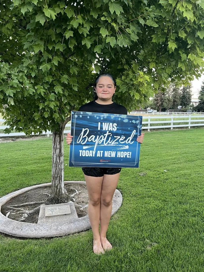A young New Hope believer celebrating baptism