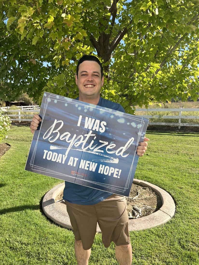 A young New Hope member celebrating his baptism
