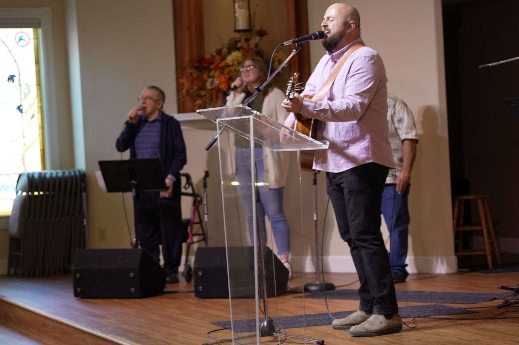 The New Hope worship team leading music from the stage on a Sunday morning