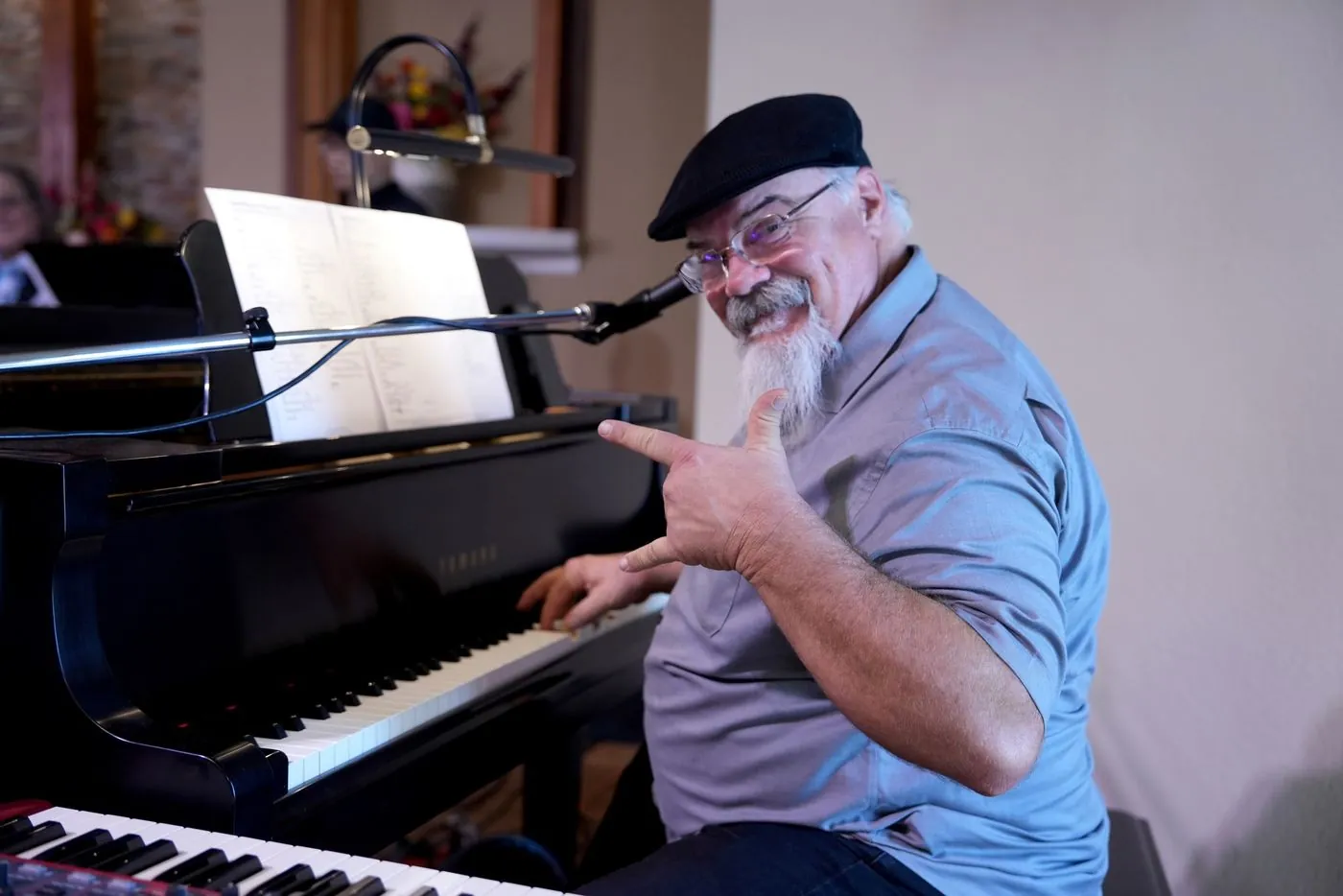 A worship team musician playing piano during a New Hope Sunday gathering