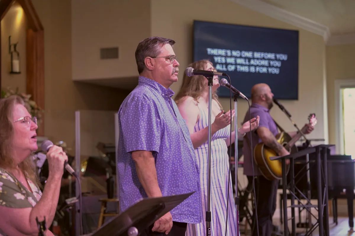 The worship team singing on Easter Sunday 2026, the words of the song on the screen behind them