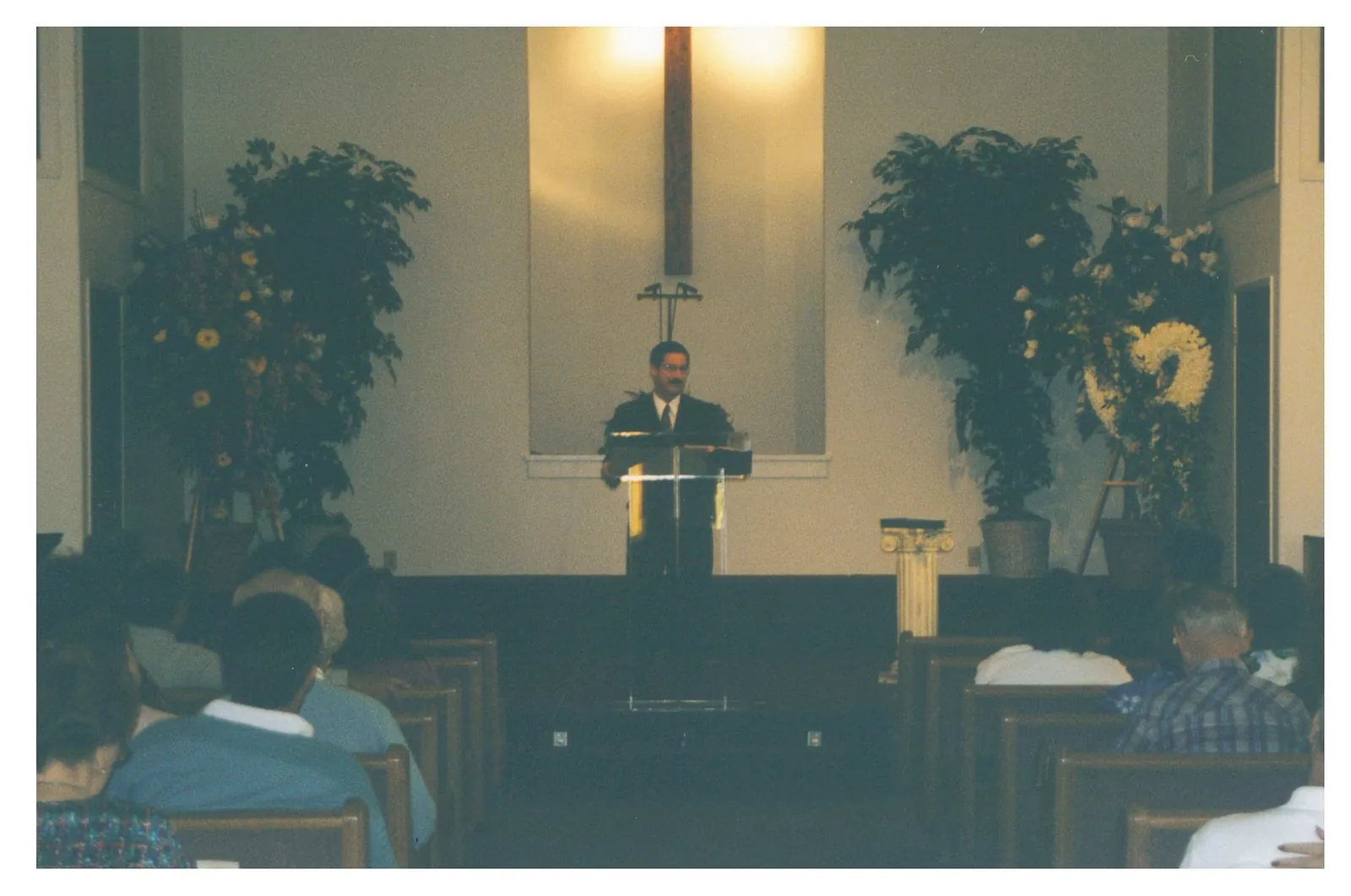 Pastor Tim Rolen preaching from the pulpit at New Hope, in front of the congregation