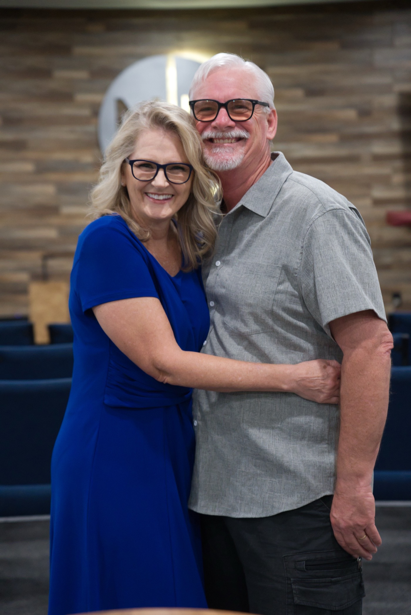 Jeff and Cindy Eidsen embracing inside the New Hope sanctuary
