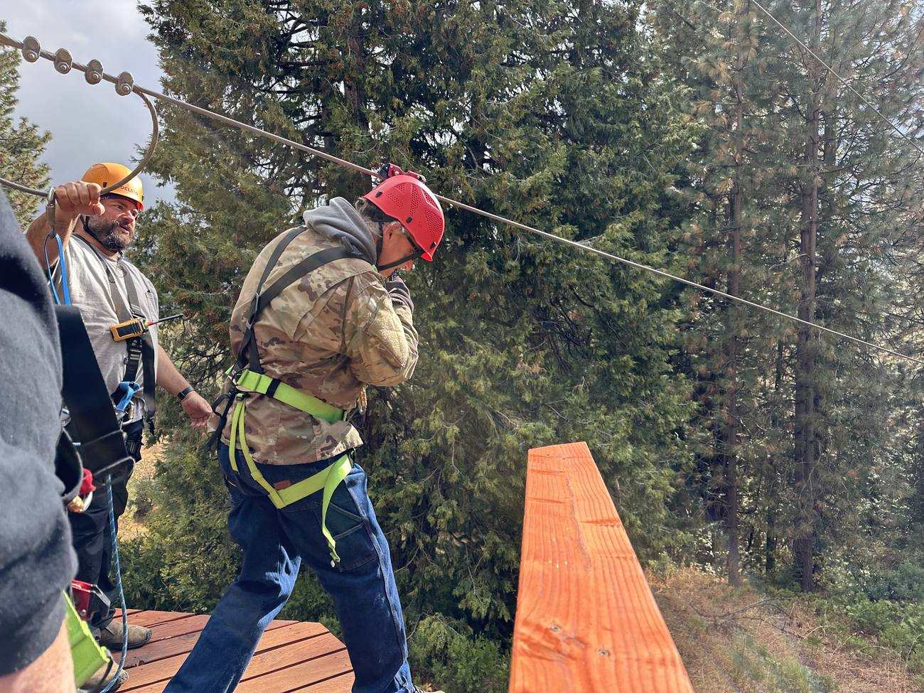 A man from New Hope crossing the high ropes course at Man Camp