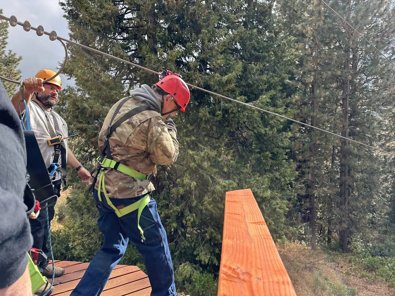 A man from New Hope crossing the high ropes course at Man Camp