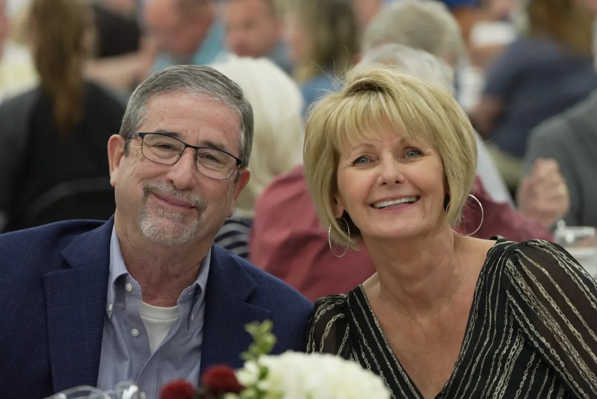 A New Hope couple smiling together at the 30th Anniversary dinner