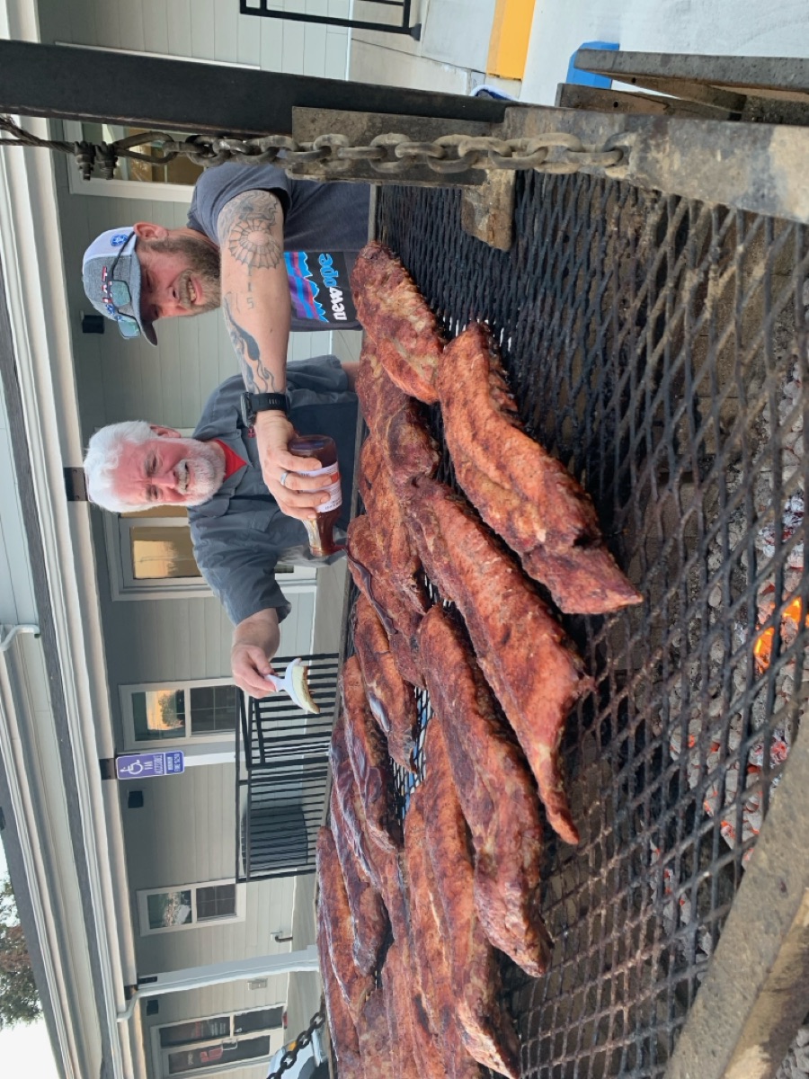 Two New Hope men tending the smoker at a Men's Ministry BBQ