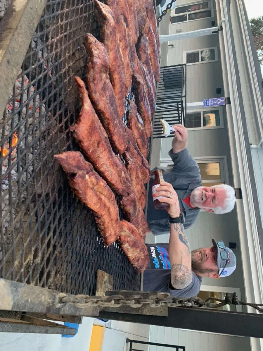 Two New Hope men tending the smoker at a Men's Ministry BBQ