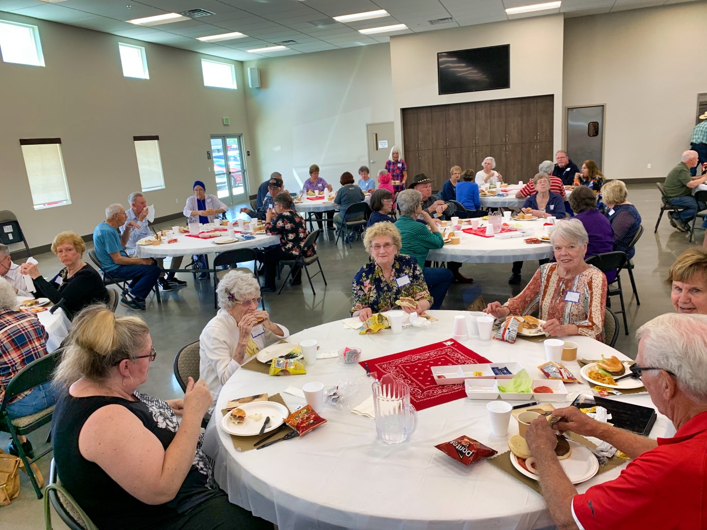 New Hope members in fellowship around a folding table after a small-group gathering in Clovis