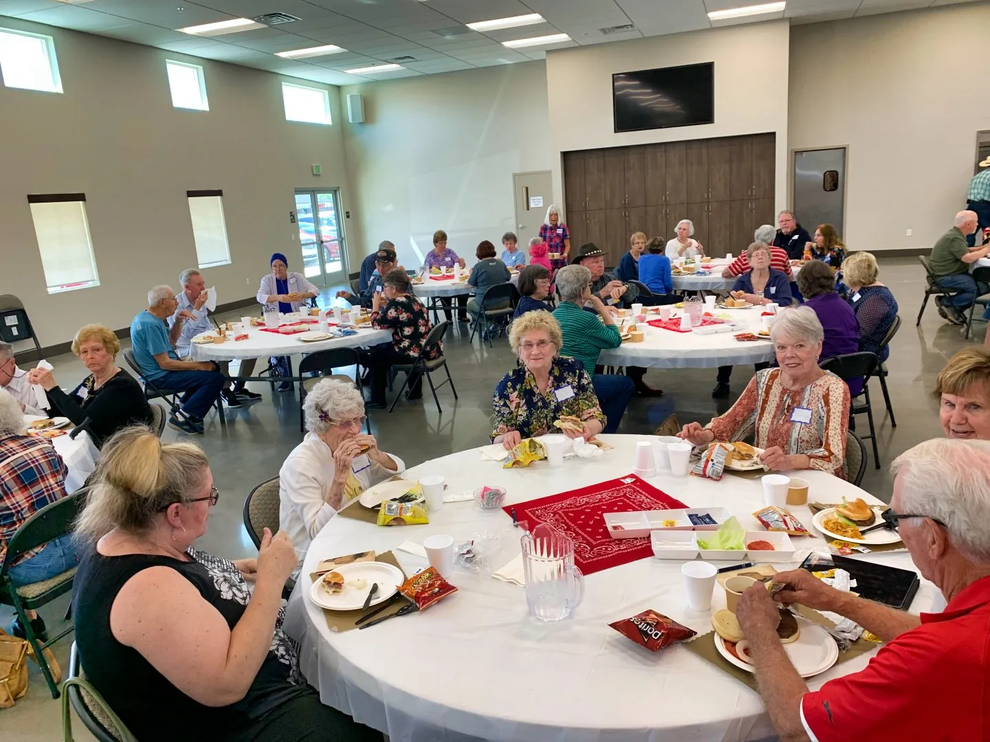 New Hope members in fellowship around a folding table after a small-group gathering in Clovis