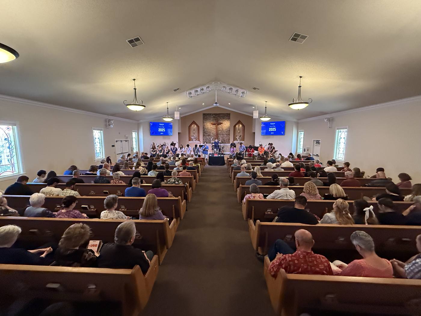 People seated in the New Hope sanctuary before a service in Clovis