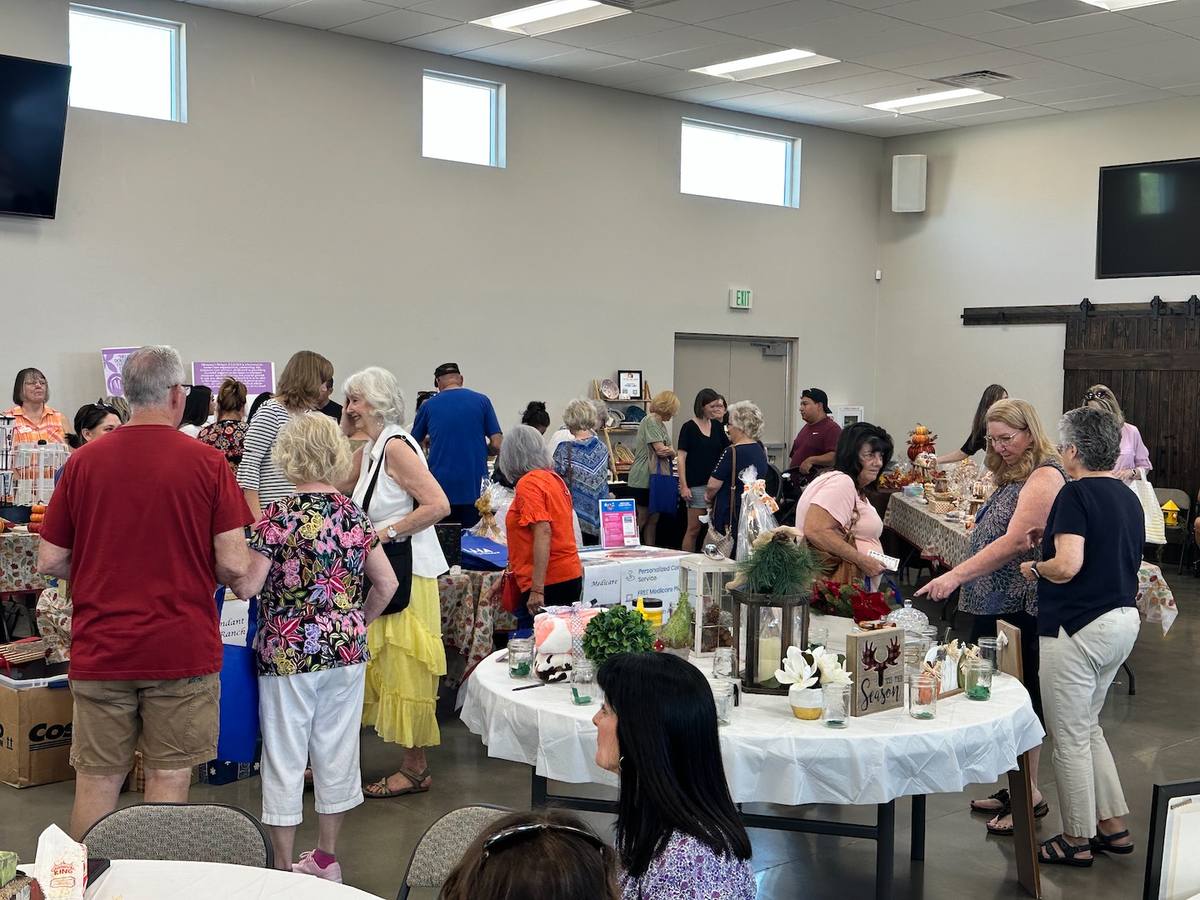 A crowded Fall Fest gathering in the New Hope event hall in Clovis