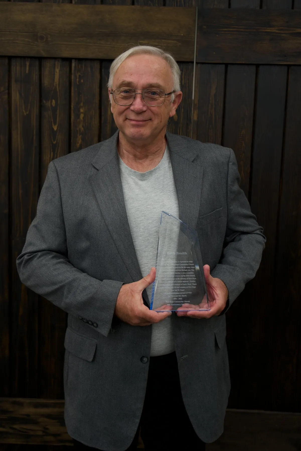 Rich Smith, 9:30 AM Adult Sunday School teacher, holding his New Hope 30th Anniversary award