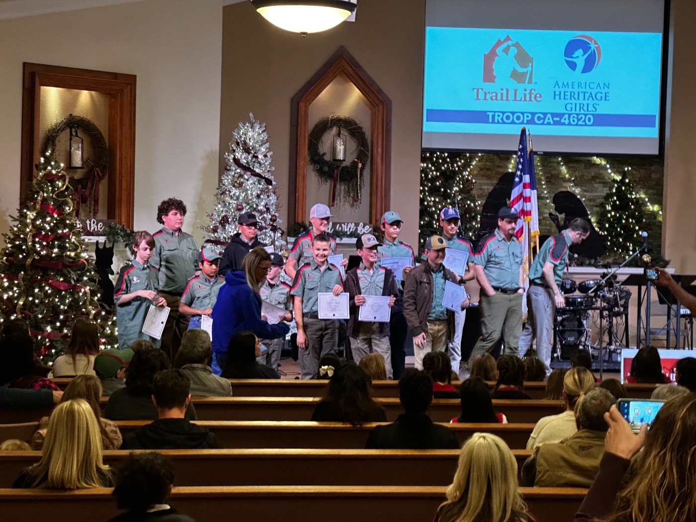 Trail Life Troop CA-4620 Trailmen receiving certificates on the New Hope stage