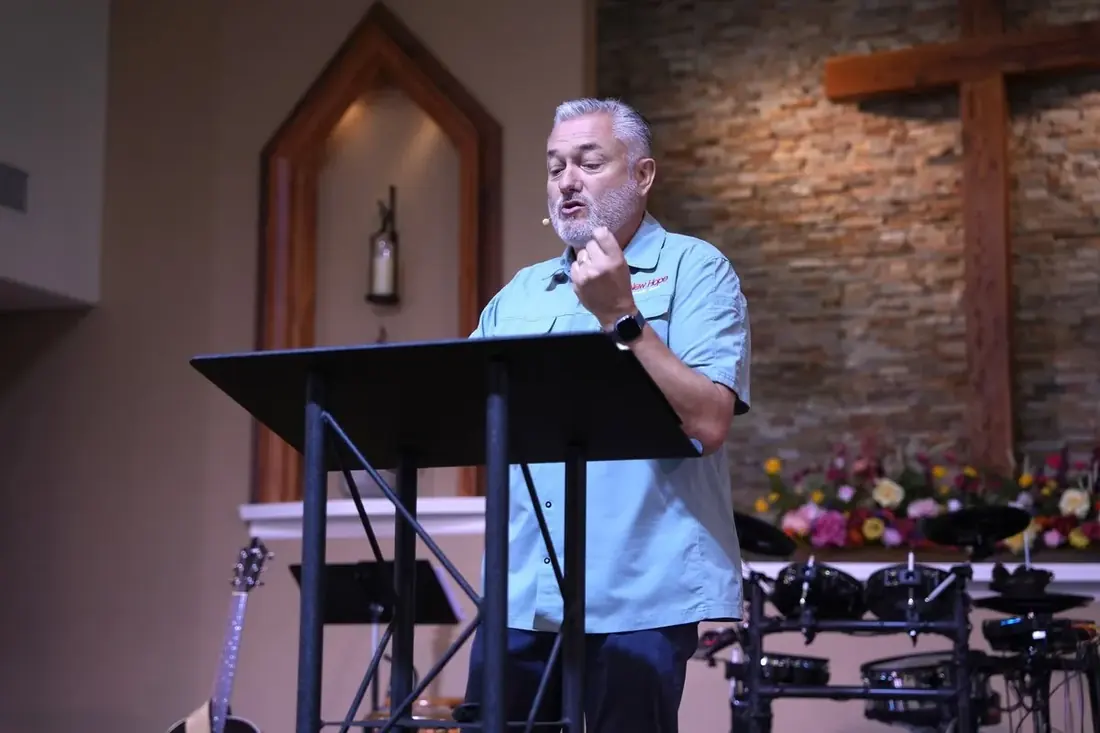 Pastor Mark Addis preaching from the New Hope sanctuary in Clovis