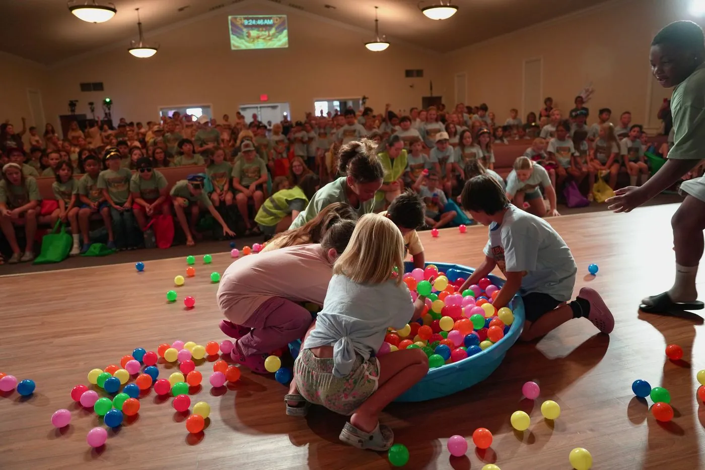 Volunteers and cadets around the Hangar Games ball pit
