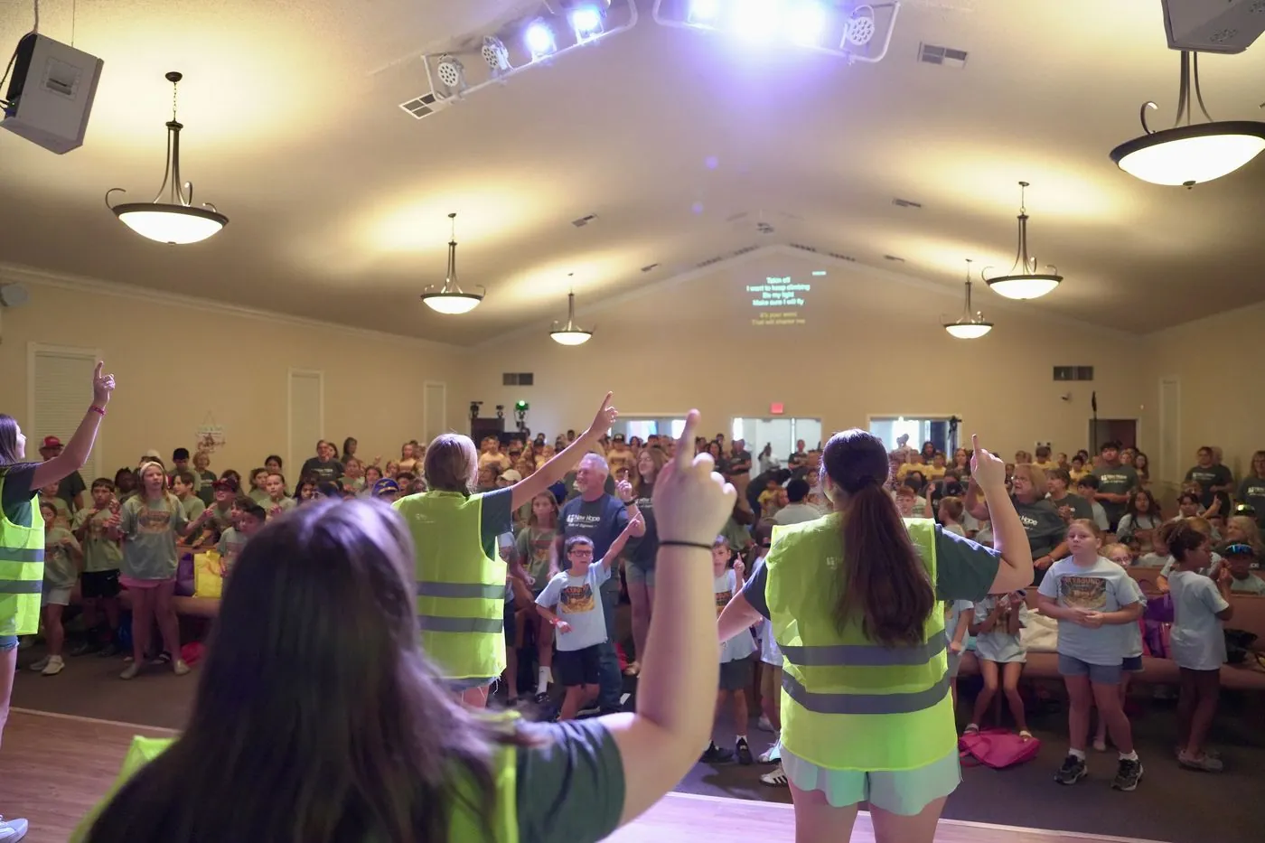 New Hope volunteers in Flight Crew vests leading Skybound worship