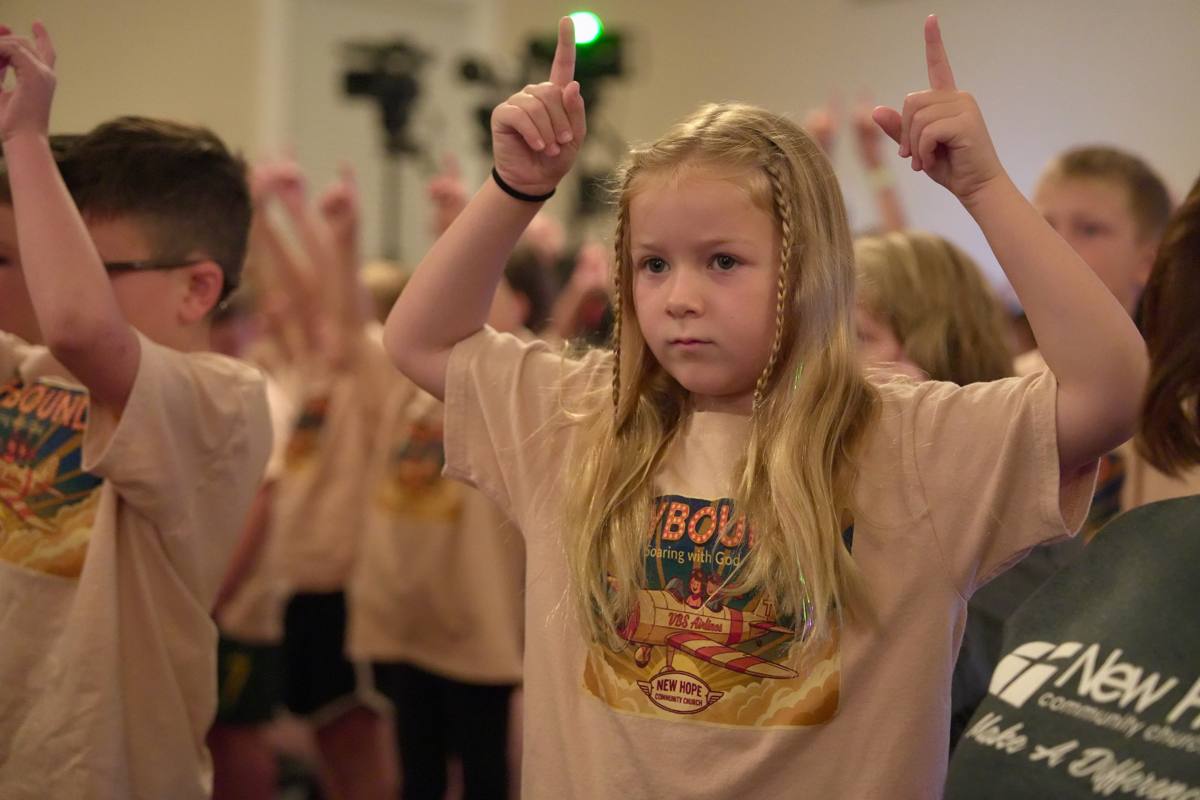 Skybound cadets worshiping with hands raised