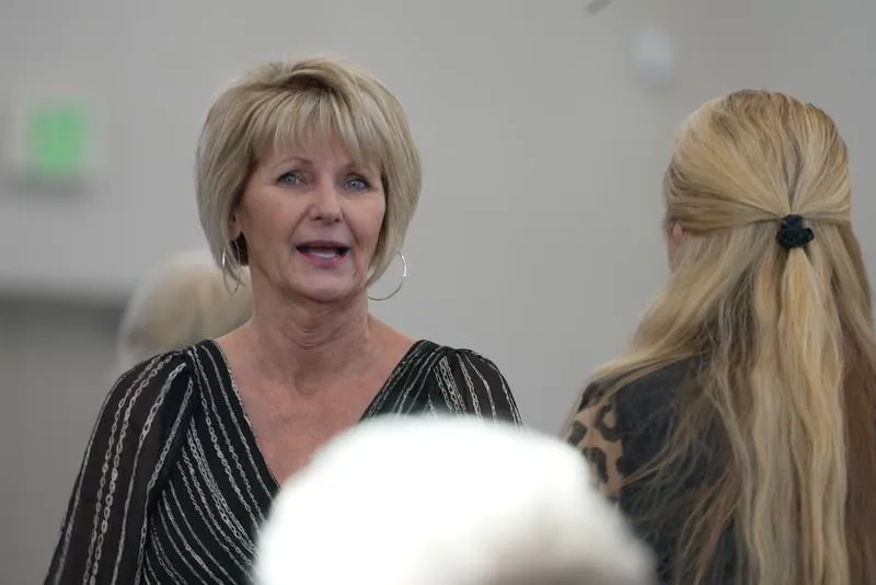 Two New Hope members catching up in conversation at a church gathering